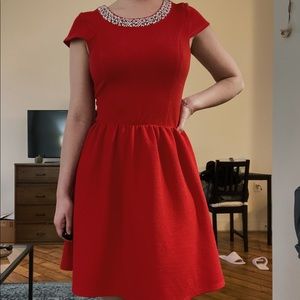 red dress with beaded neckline